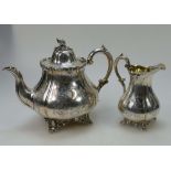 Ornate Silver teapot and milk jug hallmarked for London 1896, makers mark H.