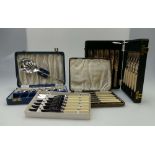 A collection of silver plated items including several boxed cutlery sets, bowls, toast rack,