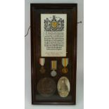 A collection of WW1 medals and bronze death plaque awarded to Gnr William James Hiles,