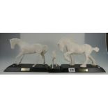 A collection of Beswick white horses to