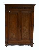 19th Century French carved oak 2 door tall storage cupboard with drawer above,