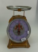 Two sided set of shop scales with lion brand decoration to front