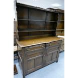 Oak buffet dresser, plate rack above two door and two drawer base.