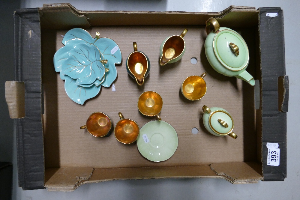 A collection of green and gilt Carlton ware items to include cups, saucers, teapot,