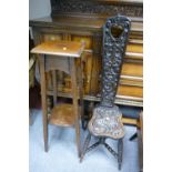 Early 20th Century oak spinning chair with facial and floral carvings and a oak plant stand (2)