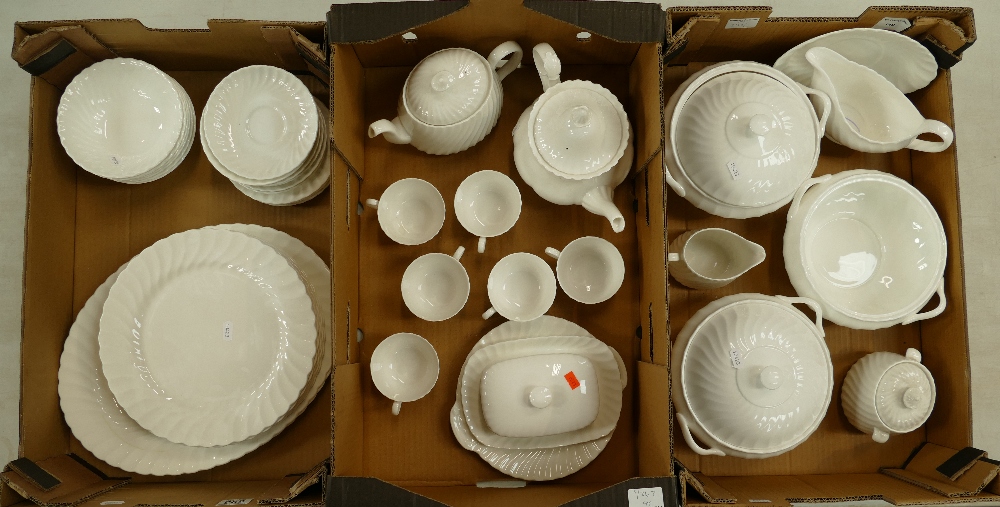 A large collection of Wedgwood undecorated tea and dinner ware to include plates, tea pot,