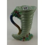 Clarice Cliffe vase in the shape of a cornucopia shell with embossed flowers,