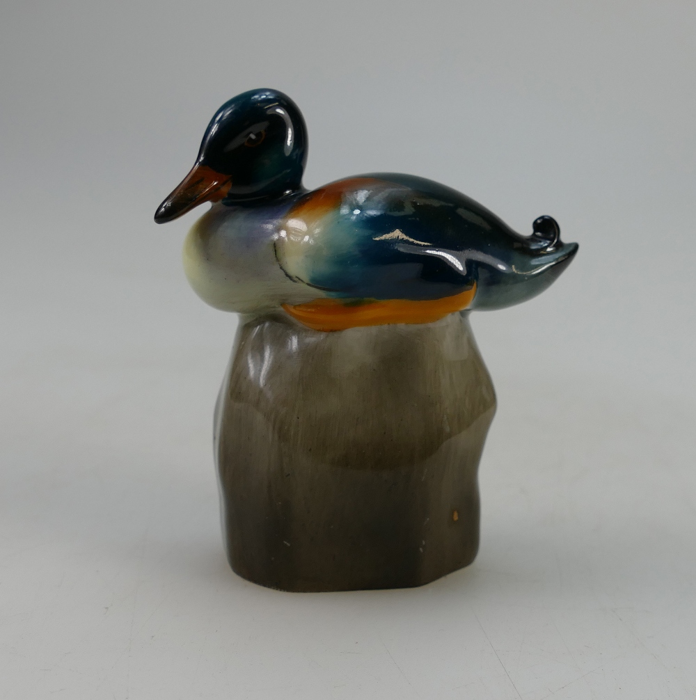 Royal Doulton rare early model of a mallard duck seated on raised rock,