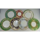 A collection of Minton gilded dinner plates including Athol, Amberley,