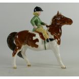 Beswick girl with green jacket on skewbald pony 1499