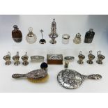 A collection of silver items to include mirror & brush set, various silver topped scent bottles,