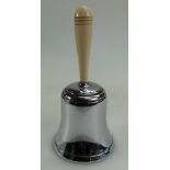 Silver plated Dunhill table lighter in the form of a bell with ivorine handle, height 16.