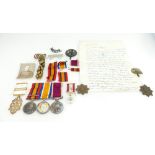 A collection of medals and badges awarded to Sergeant Herbert Jebb from the 2nd Hampshire Regiment