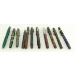 A collection of vintage fountain pens including Conway Stewart,