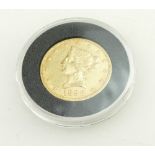 United States 1896 gold ten dollar coin with Liberty head, cased in plastic (gold weight 16.
