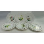 A set of Minton ribbon plates each hand painted with various flowers and foliage,