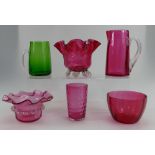 A collection of Victorian cranberry glass items including bowls, jugs,