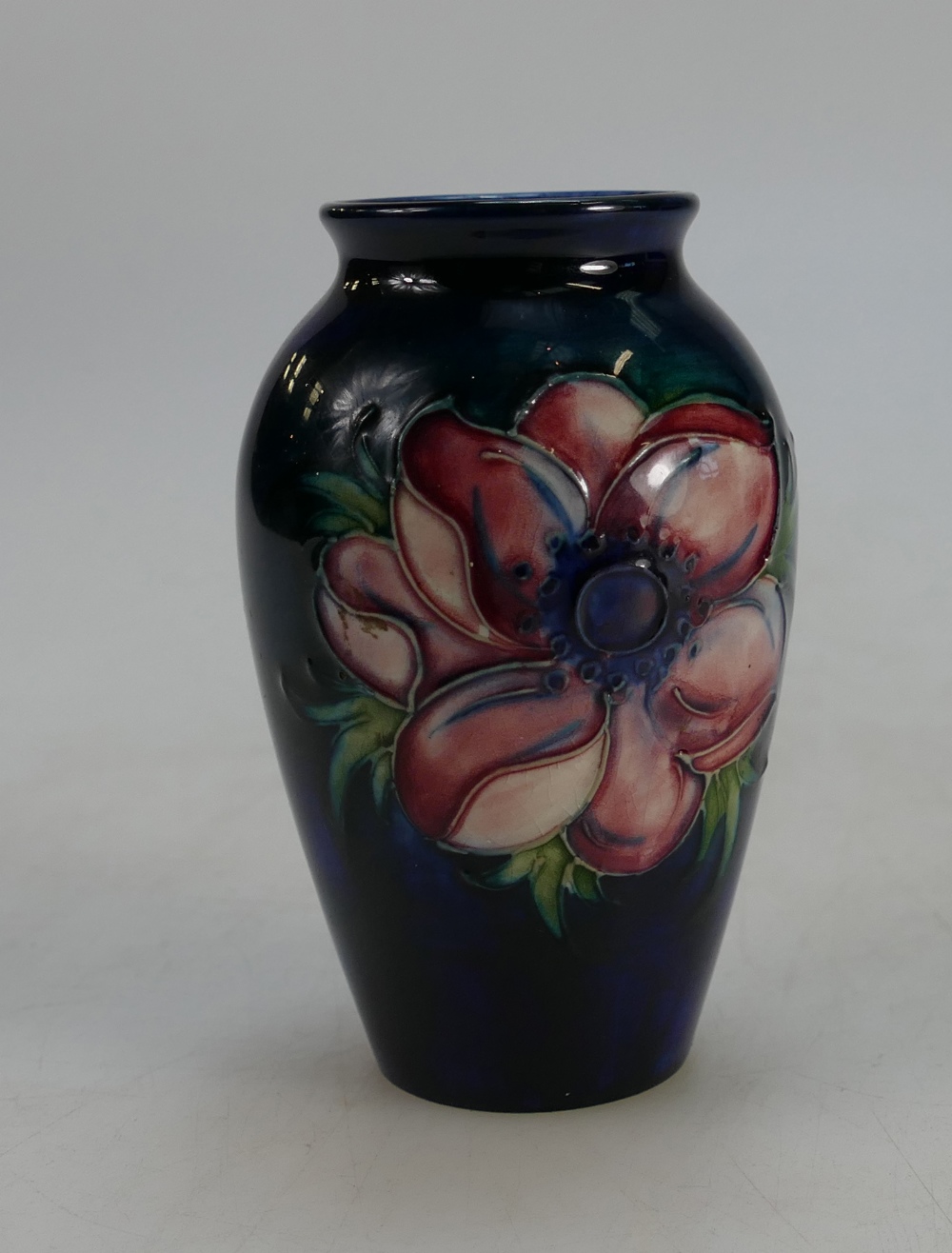 Moorcroft small vase decorated in the Anemone design, height 10.