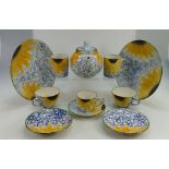 A collection of modern Poole pottery hand painted dinnerware to include cups, saucers,