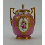 Minton small gilded two handled vase and cover hand painted with panels of flowers,