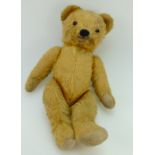 Early 20th century golden mohair straw filled Teddy bear with open mouth (worn)