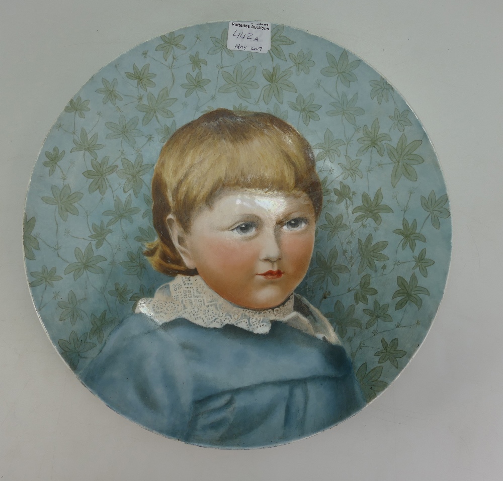 19th Century hand painted pottery plaque of a young man ''Claud'', label to reverse ''Howell & James