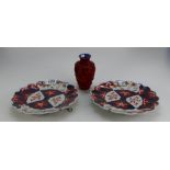 Two unmarked Japanese export ware decorative wall plates together with red lacquered vase (3)
