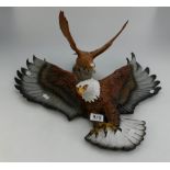 Beswick matt golden eagle 2062 together with Bossons bald eagle wall plaque.