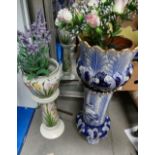 2 unmarked ceramic plant stands one with floral decoration on cream,