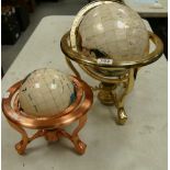 Two Gemstone Globes on metallic gold and copper coloured stands,