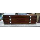 A long wooden multi draw chest