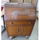 Carved oak panelled bureau