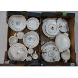 A large collection of Poole Pottery dinner ware with blue floral decoration to include tureens,