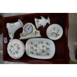 A collection of Wedgwood Wild Strawberry items to include trinket plates, mantle clock, vases, etc.