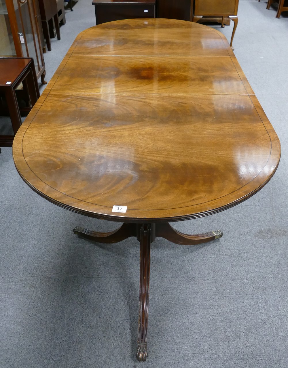 A Dining table with 3 leaves and with made to measure protective pads.