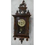 Early 20th Century walnut small Vienna wall clock with horse carved to top