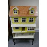 Quality handmade 3 story dolls house with 6 rooms on a Queen Anne painted black stand