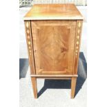 A Inlaid Regency style cabinet on tapered legs.