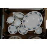 A collection of English fine china tea and dinnerware in the blue floral pattern to include cups,