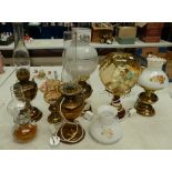 A large collecrtion of reproduction type electric and paraffin table lamps (7)