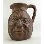 Large Grotesque Eathernware face jug, he