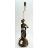 A large resin bronze affect lamp base as female standing on wood base, height to top of fitment