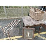 A oak dining table with a BT tub bench and a large wicker basket, together with 2 oak picture/mirror