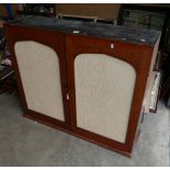 A two door Mahogany Victorian free standing display cabinet (glazed front replaced with cloth