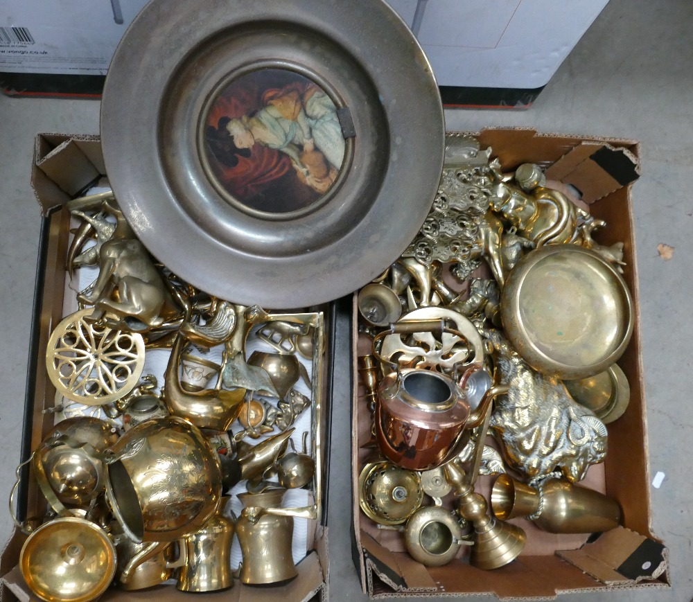 A large collection of brass and copper items to include fireside animals, dolfins, dogs, cats,