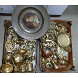 A large collection of brass and copper items to include fireside animals, dolfins, dogs, cats,