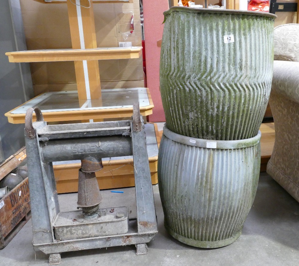 Two dolly tubs and a green house oil heater. (3)