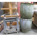 Two dolly tubs and a green house oil heater. (3)
