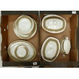 A collection of Royal Doulton antique gold patterned dinnerware to include dinner plates, side