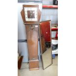 Oak cased Art Deco clock and a large rectangular framed wall hanging mirror. (2)